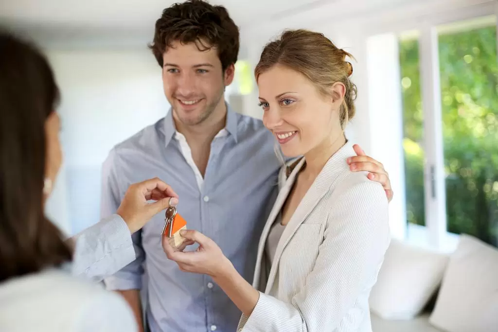 Stock Photo Happy Young Couple Getting Keys Of Their New Home